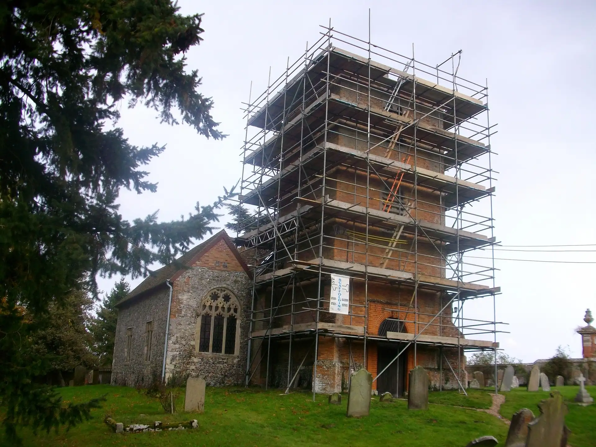 Scaffold around the brick tower of a church in Newbury for repointing works