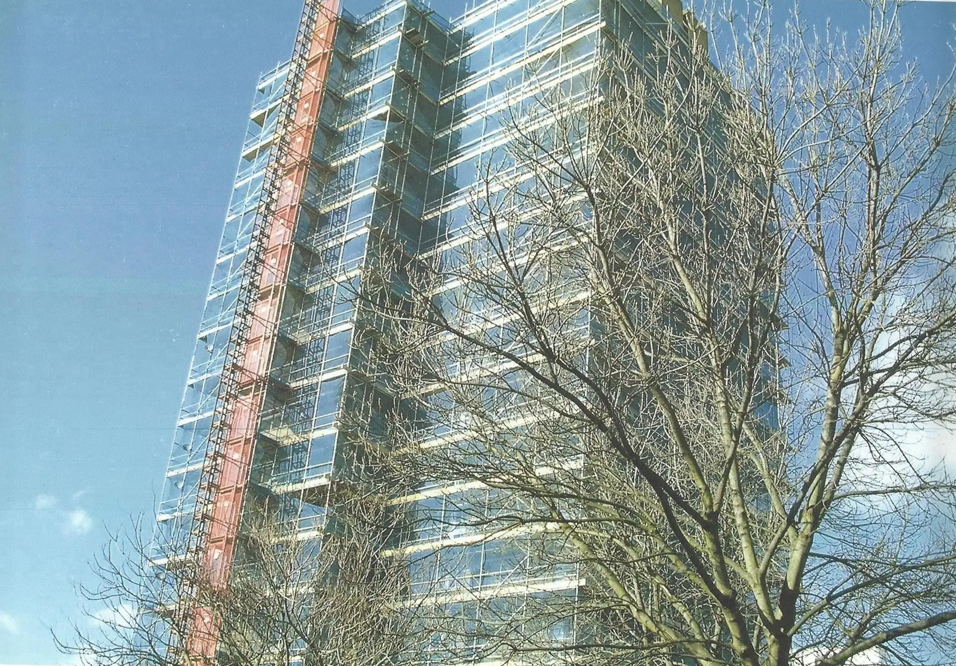 Scaffolded tower block in Slough with a construction hoist running up the side